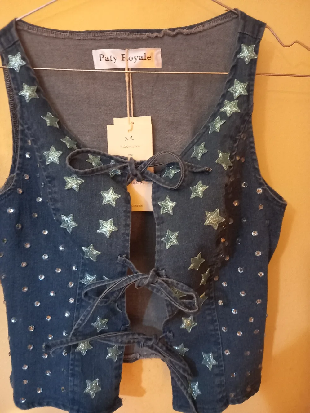 Chaleco vaquero de estrellas con lazos